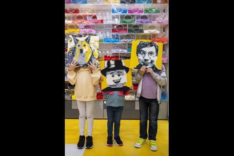 Customers holding Lego portratis